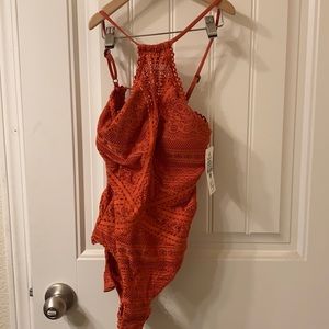 Brand new BECCA one peice swim suit orange